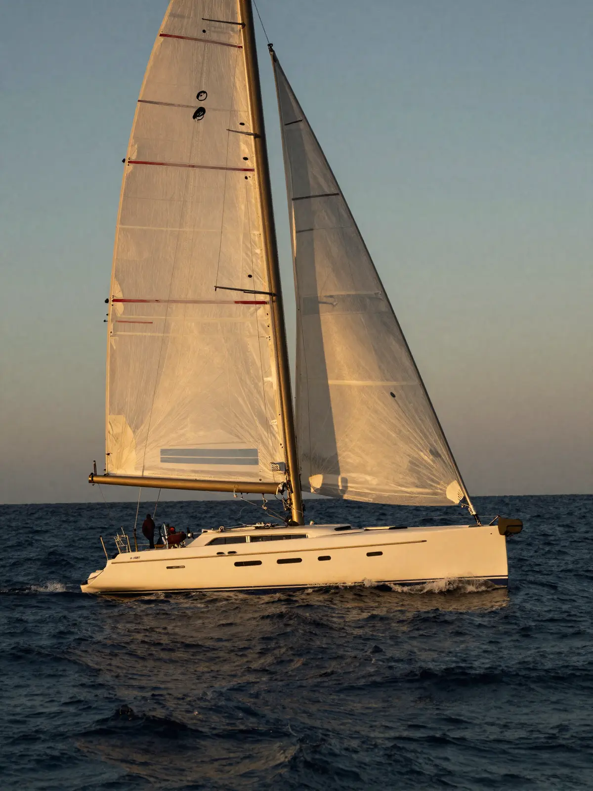 A Sailing yacht on calm open water